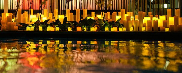 Candles with reflection in water