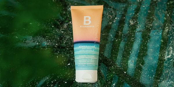 Bluphoria product tube against a green background