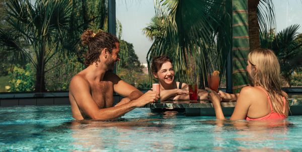 Three people at a pool bar