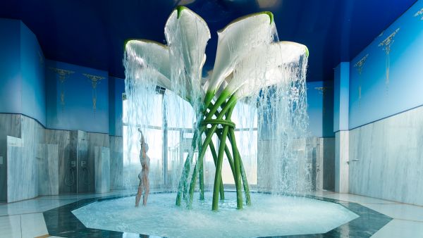 Woman under calla calyx shower